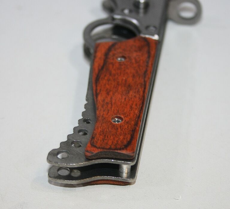 noz-sprezynowy-z-uchwytem-na-palec-model-00