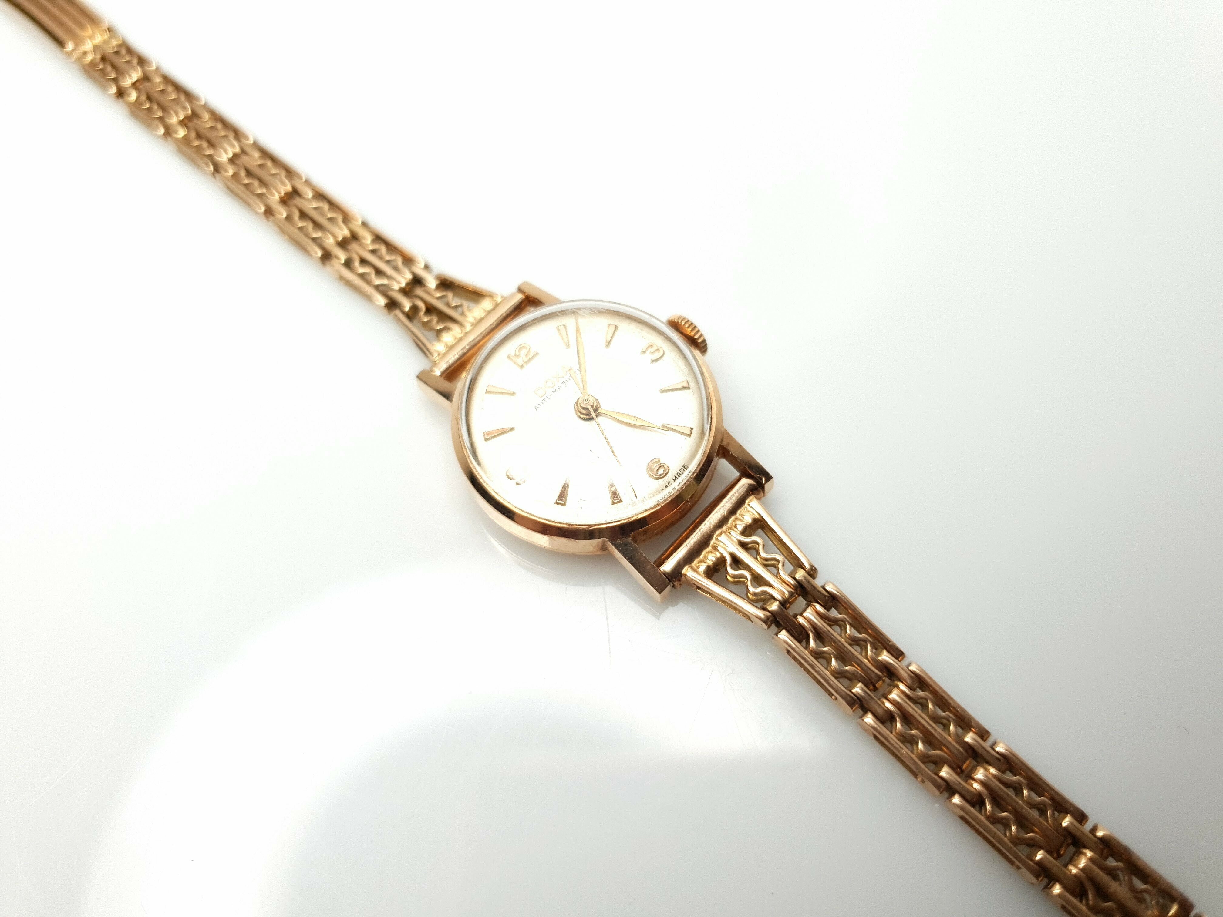 oryginalny-zloty-zegarek-doxa-13716-14k-2318g-ksztalt-koperty-okragla