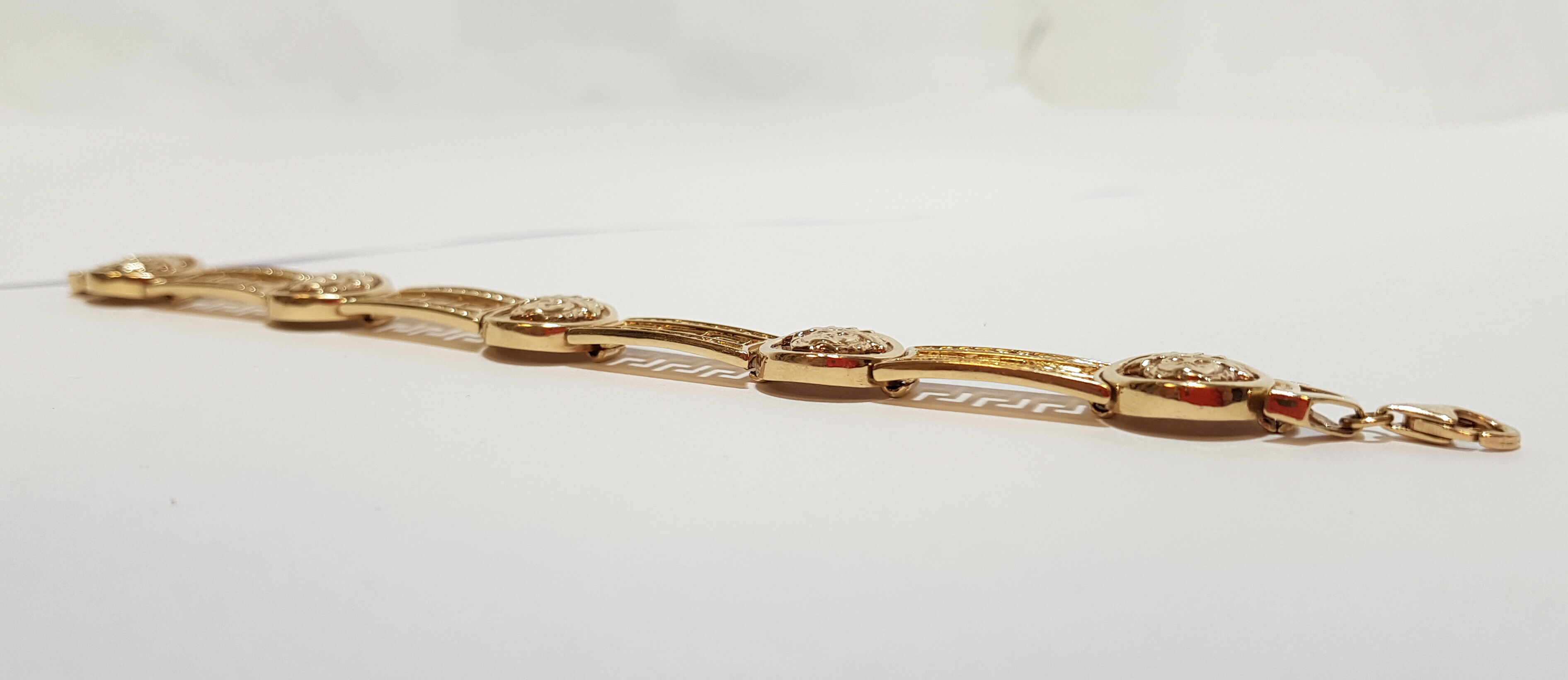 zlota-damska-bransoletka-versace-14k-kamien-bez-kamienia