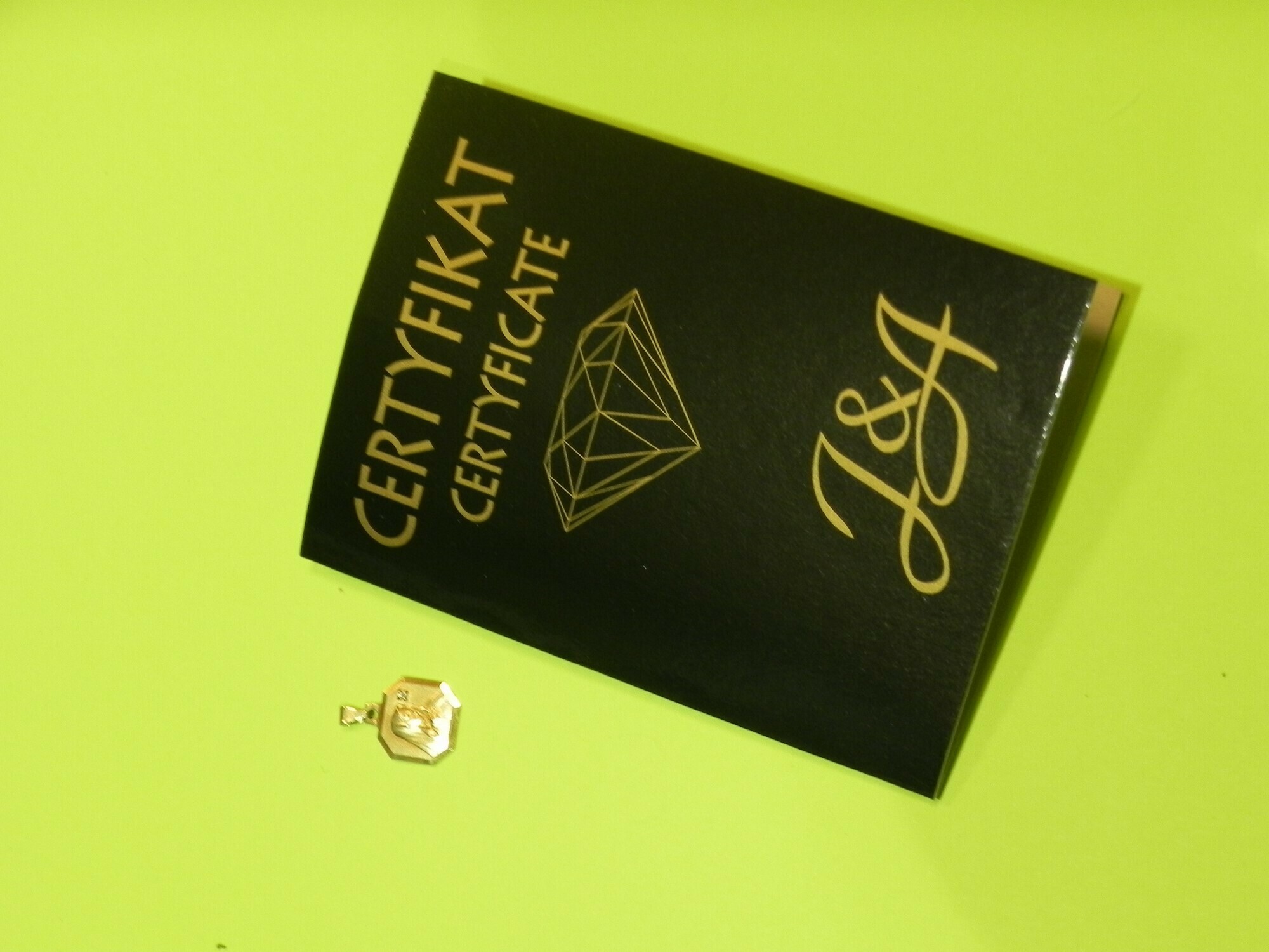 zloto-zlota-zawieszka-proba-585-1-diament-stan-uzywany