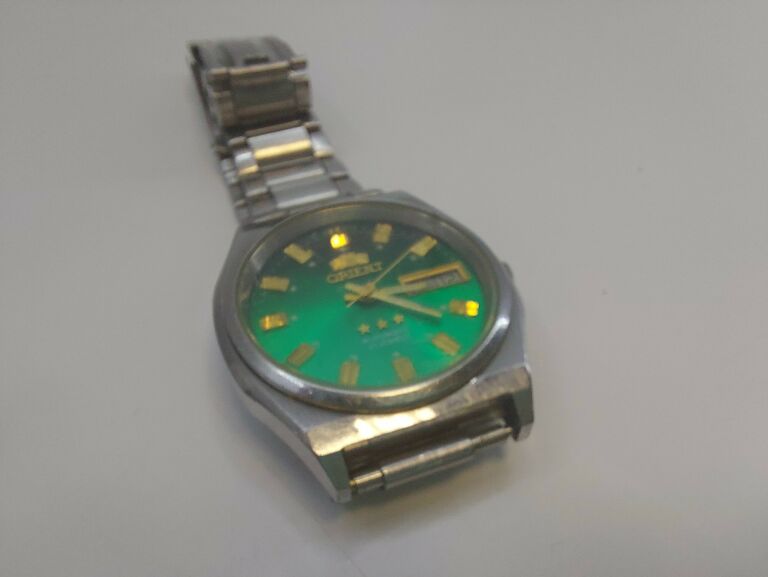 zegarek-orient-l469711-zielony-material-paska-posrebrzany