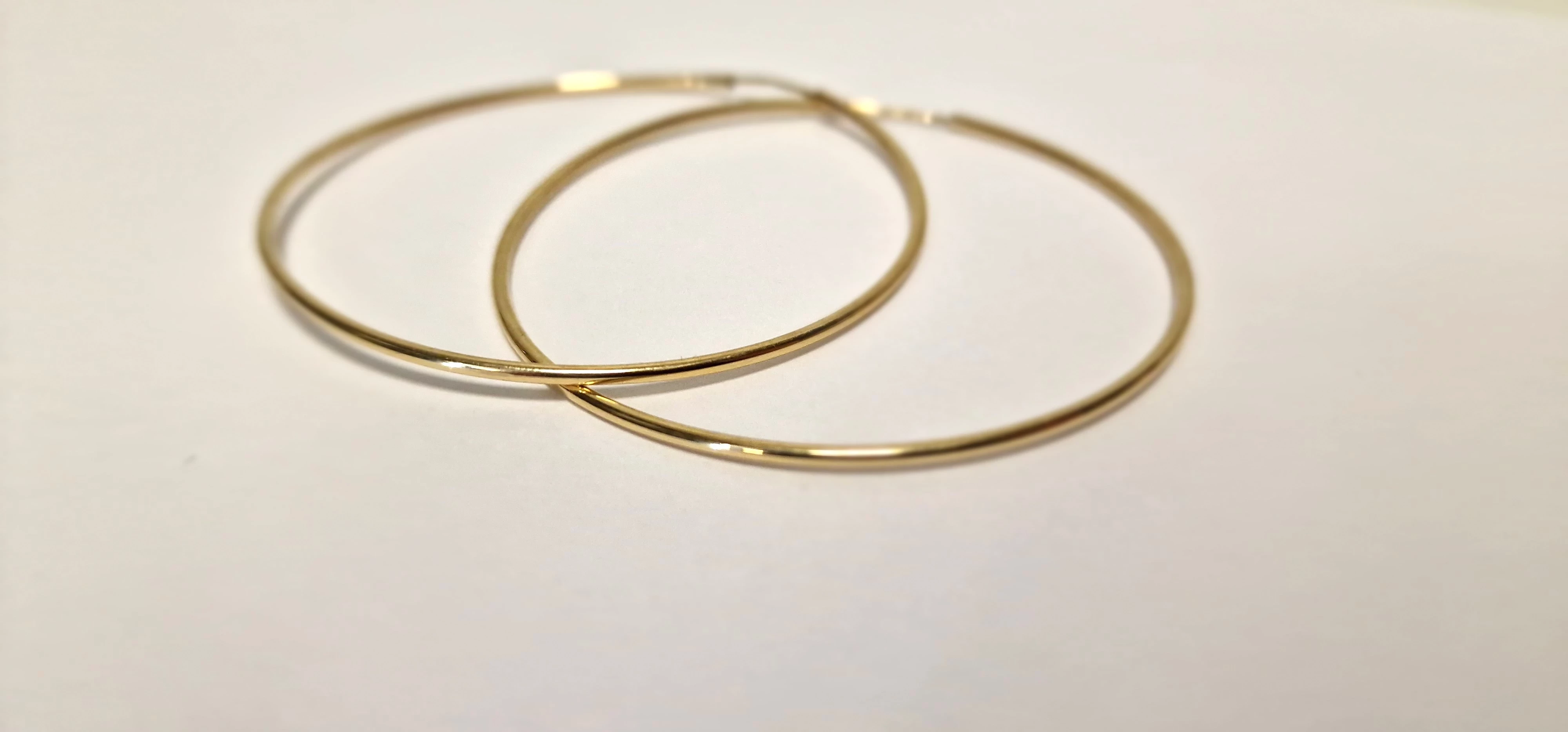 zlote-kolczyki-kola-stan-powystawowy