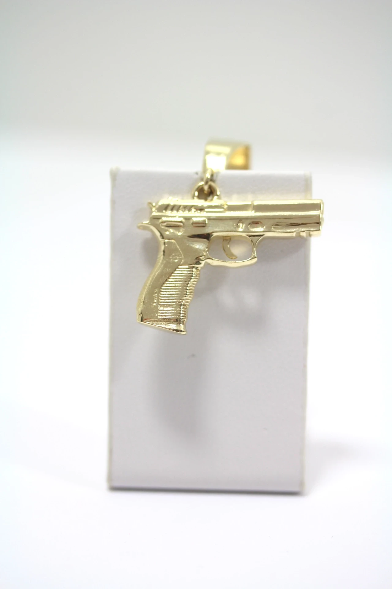 zlota-zawieszka-pistolet-585-1257g-kamien-bez-kamienia