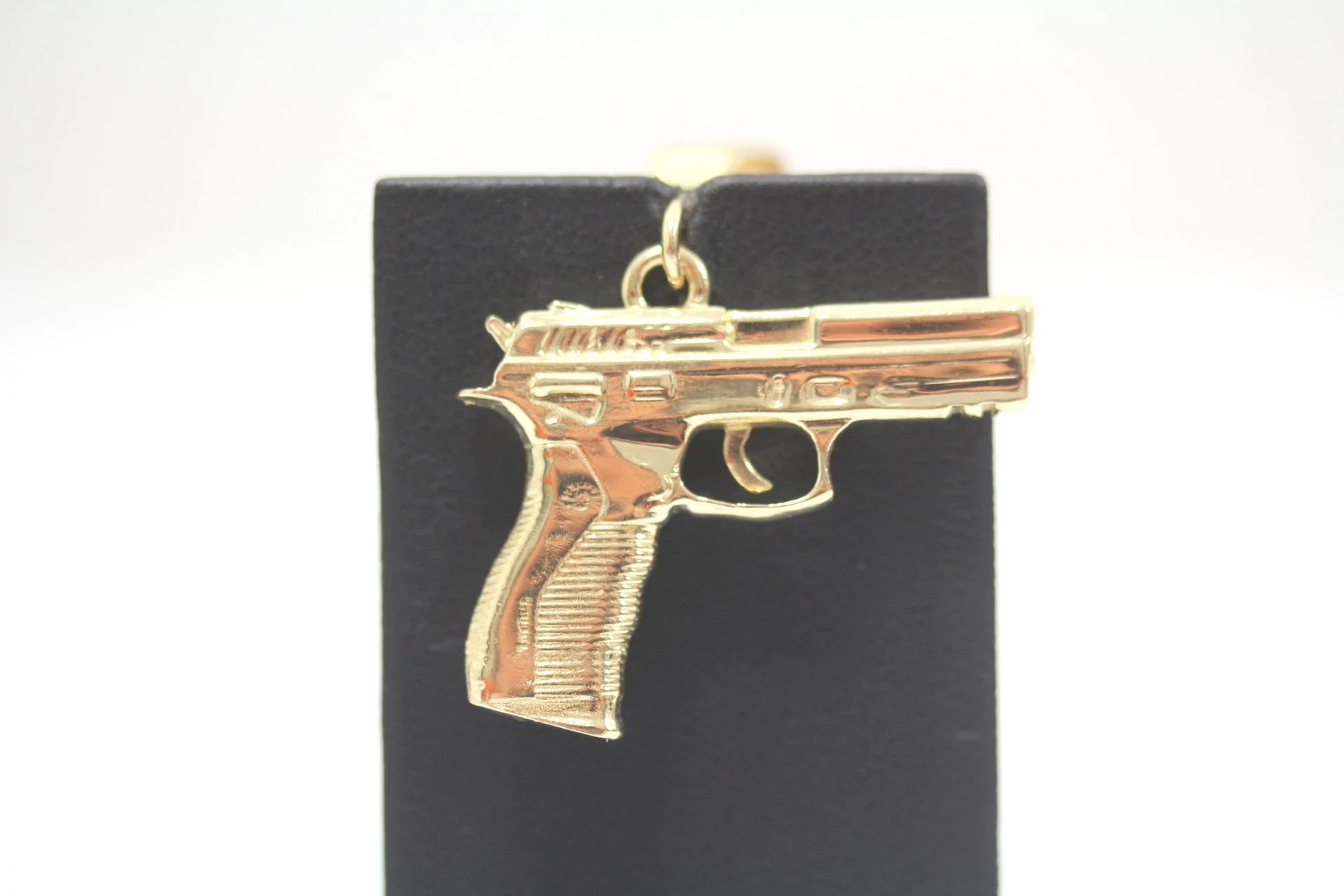zlota-zawieszka-pistolet-585-1257g-waga-1257
