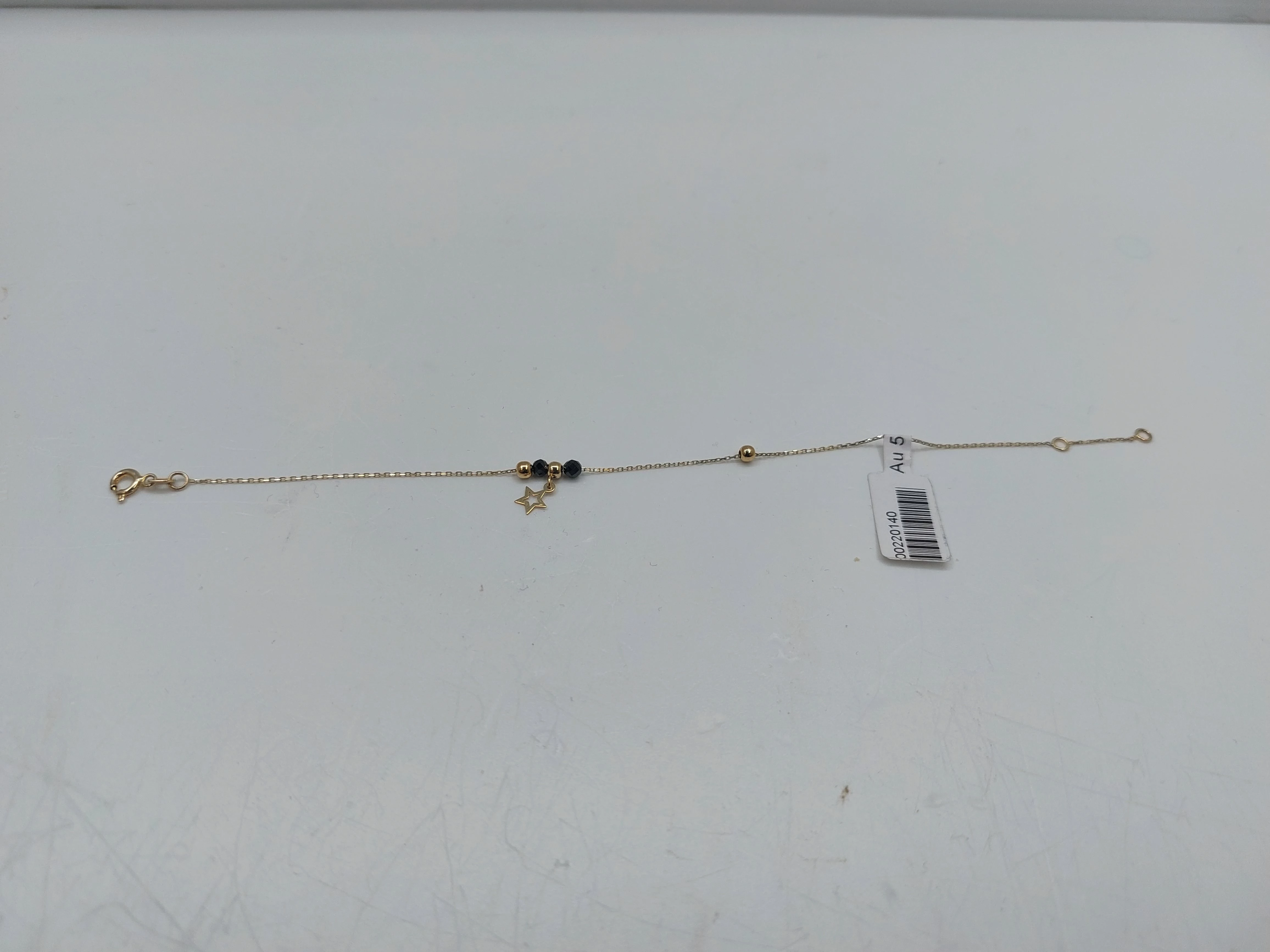 bransoletka-z-czarnymi-kamieniami-i-kulkami-opis-marka-inna-marka