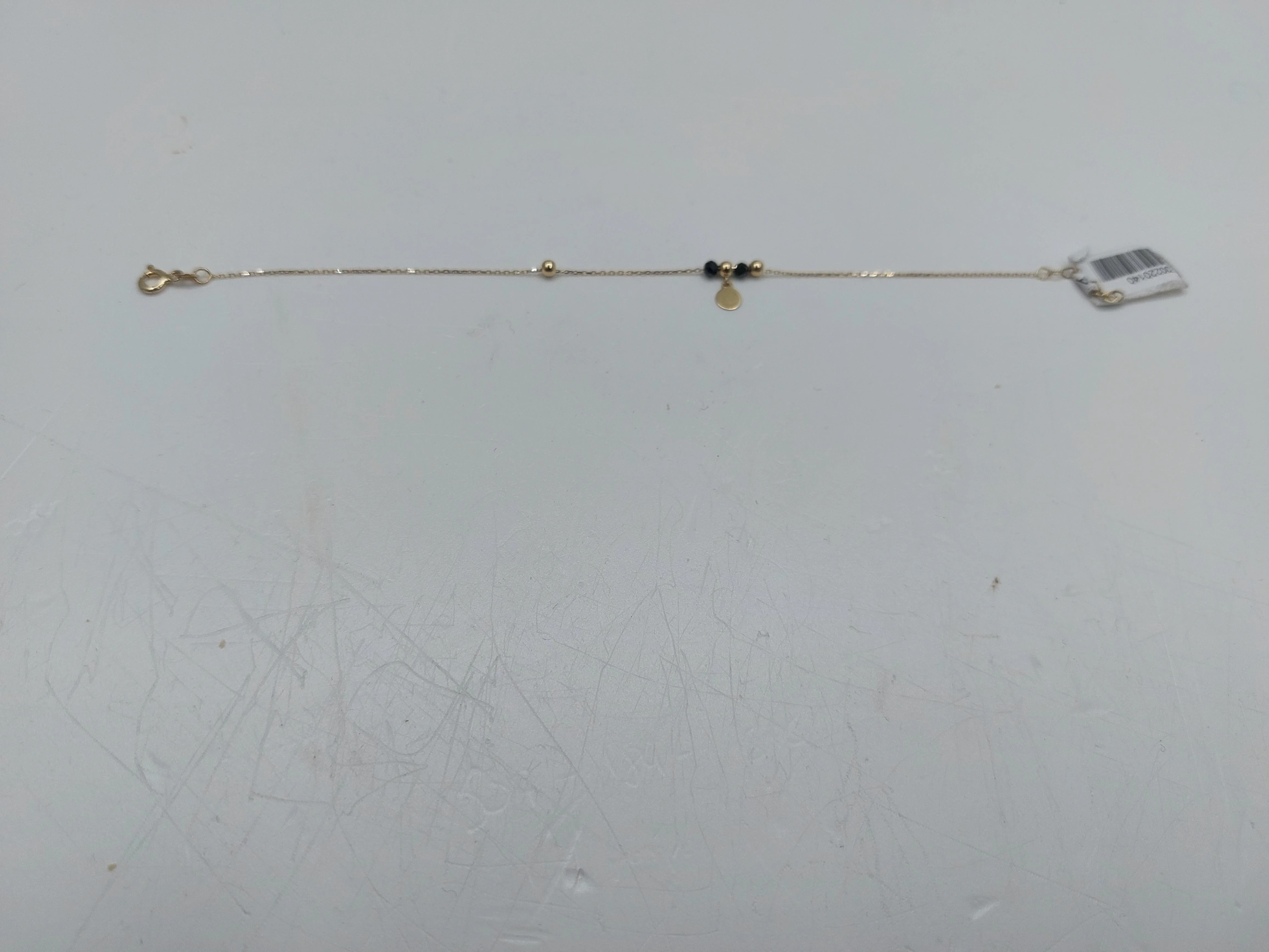 bransoletka-z-czarnymi-kamieniami-i-kulkami-opis-rodzaj-wyrob-jubilerski