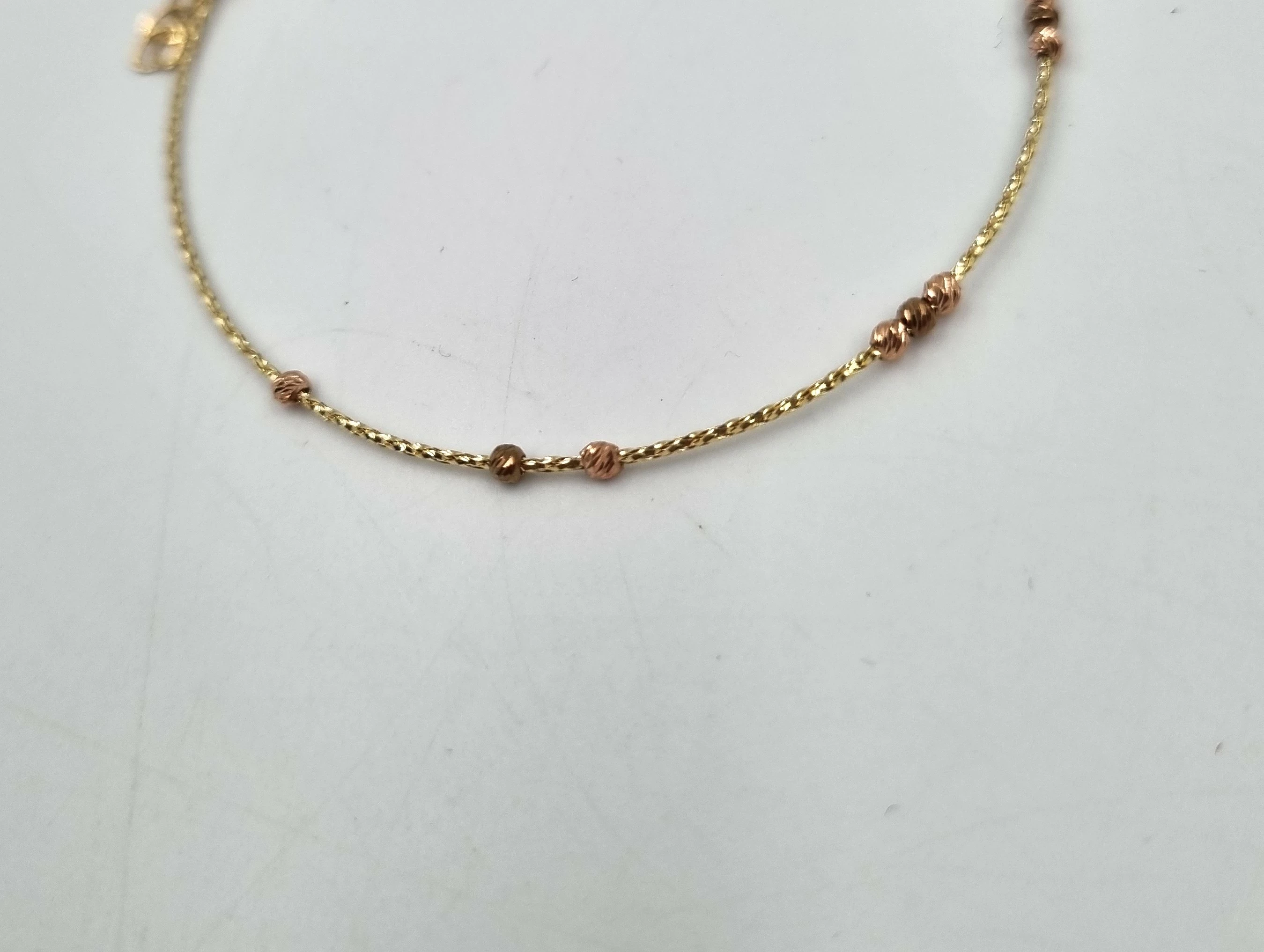 piekna-nowa-zlota-bransoletka-585-088g-kulki-19cm-marka-inna-marka