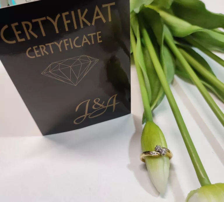 ZŁOTY PIERŚCIONEK Z BRYLANTEM 4,34GR 750PR 0,25