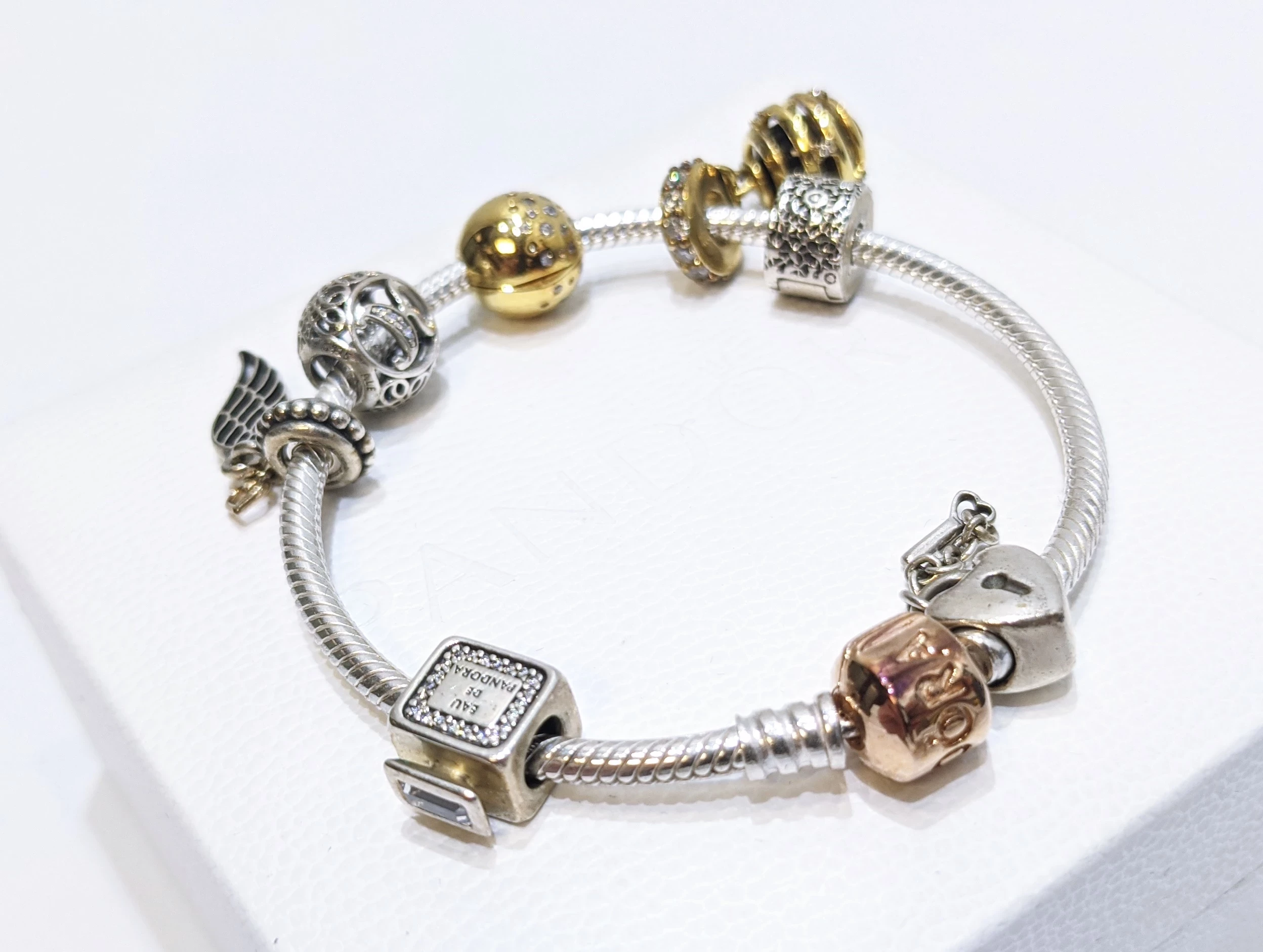 bransoletka-pandora-bangle-rose-gold-7-charms-17cm-rudnickiego-10-warszawa