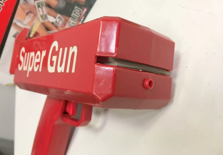 ZABAWKA PISTOLET ROZRZUCAJĄCY PIENIĄDZE DOLARY