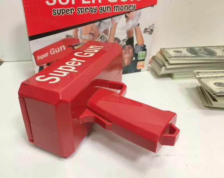 ZABAWKA PISTOLET ROZRZUCAJĄCY PIENIĄDZE DOLARY