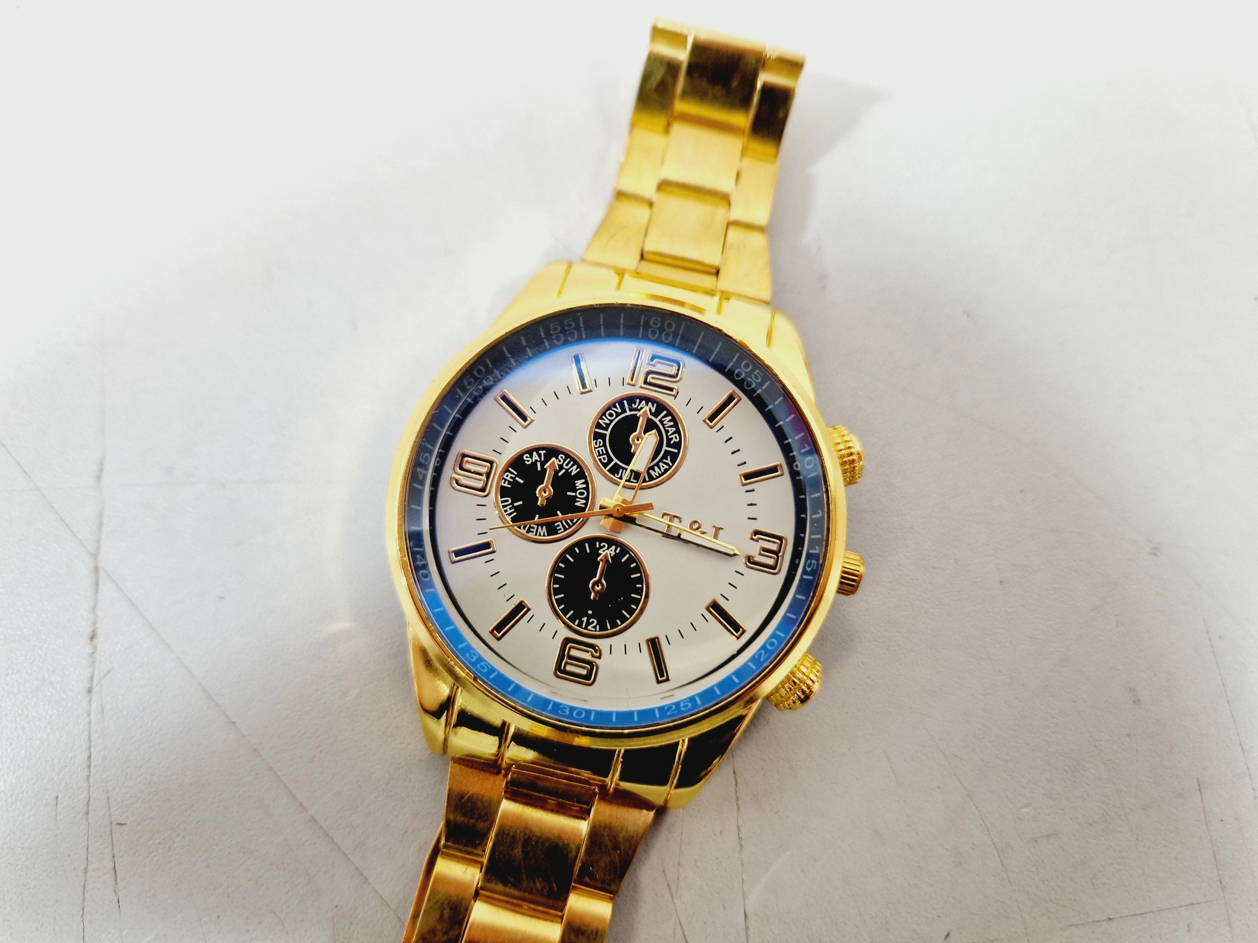 zegarek-meski-tl-t-and-l-w-kolorze-zlotym-opis-ksztalt-koperty-okragla