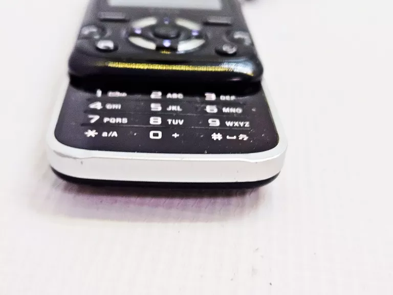 TELEFON SONY ERICSSON F305 ORANGE + ŁAD/SŁUCHAWKI