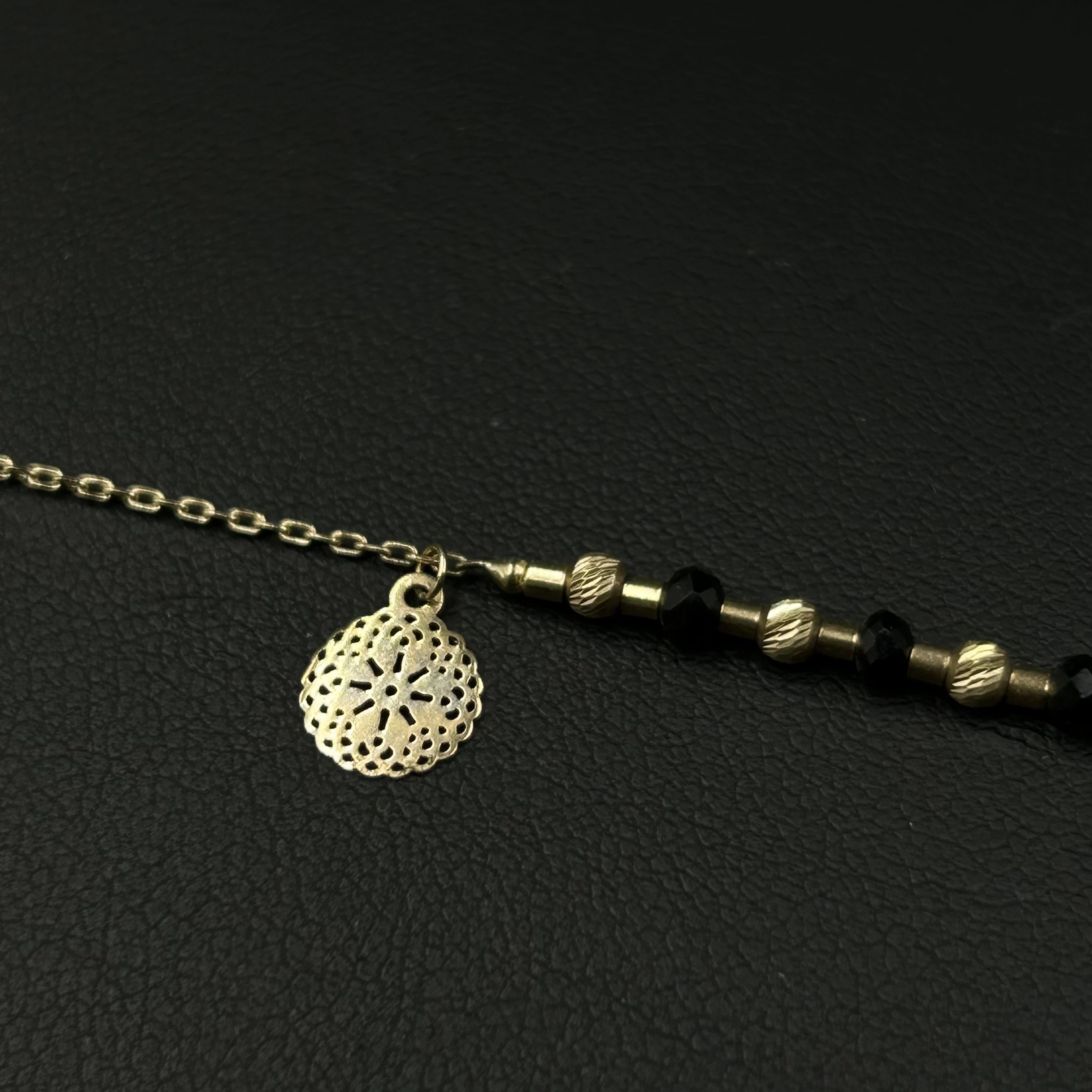 piekna-nowa-zlota-bransoletka-z-czarnymi-kuleczkami-58514k160-g18-cm-stan-11323-1