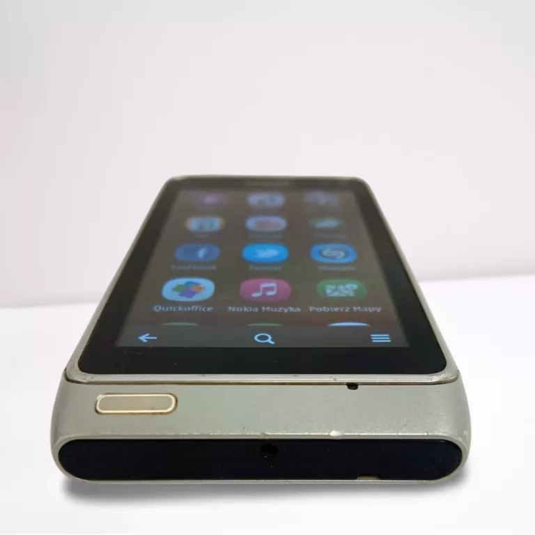 TELEFON NOKIA N8-00 Z WYŁAMANĄ KLAPKĄ NA KARTY SIM
