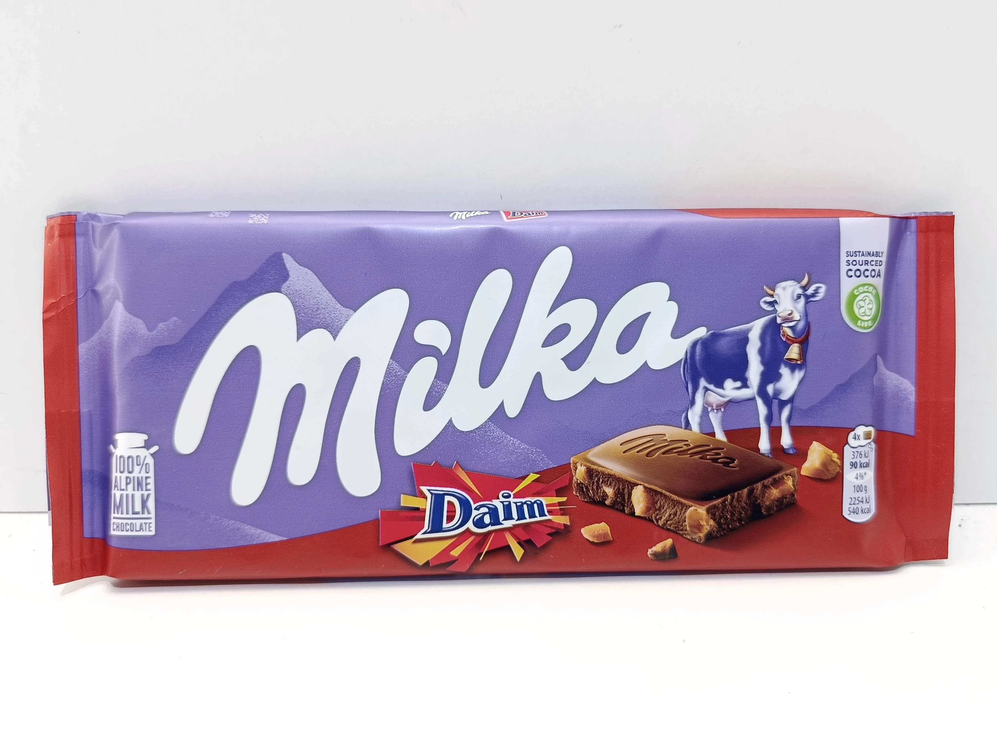 milka-daim-czekolada-mleczna-z-kawalkami-karmelu-karmelem-100g-jednosci-narodowej-1091b-sj-wroclaw